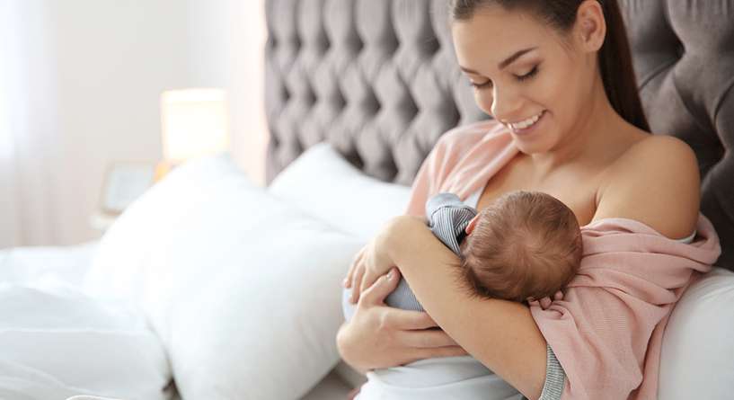 Interpretation of a dream about breastfeeding a male child for a married woman
