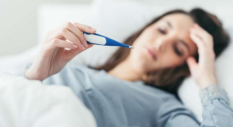 هل ارتفاع درجة الحرارة قبل الدورة من علامات الحمل