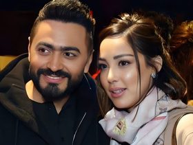 تامر حسني ينشر صورة عائلية تجمعه مع بسمة بوسيل تهنئةً بقدوم عام 2024